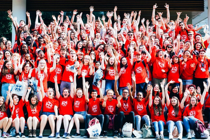 Large group of Edinburgh University students cheering